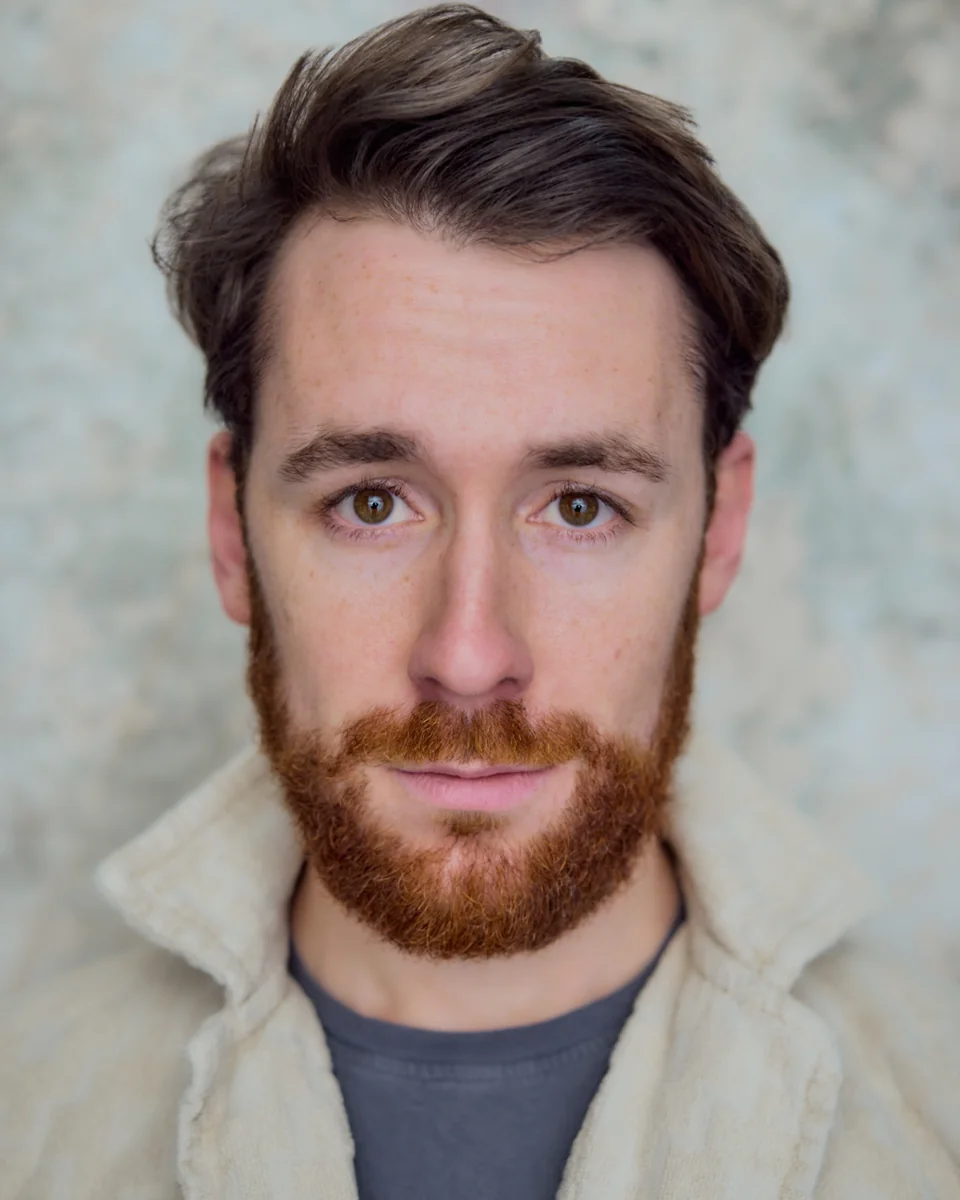 Nick Hyde in a cream jacket