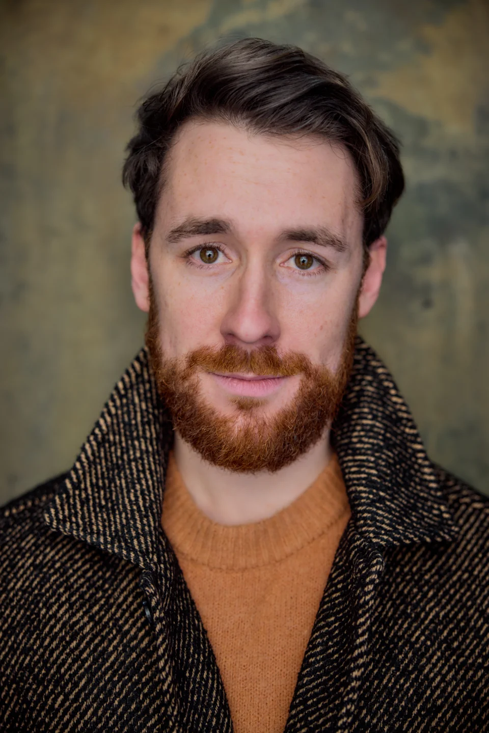 Nick Hyde in an ochre jumper and dark coat