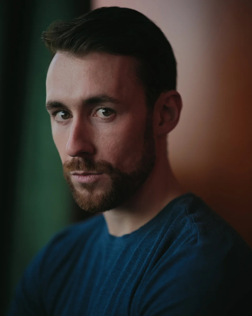 Nick Hyde in a blue jumper, photographed by Phil Sharp